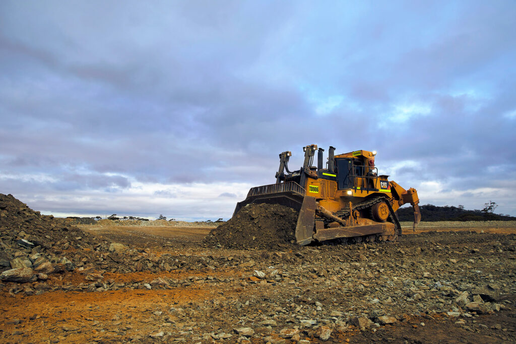 doser-moving-pile-of-dirt-across--mine-field