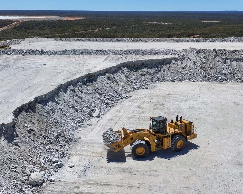 loader-scooping-minerals-on-ROM-pad