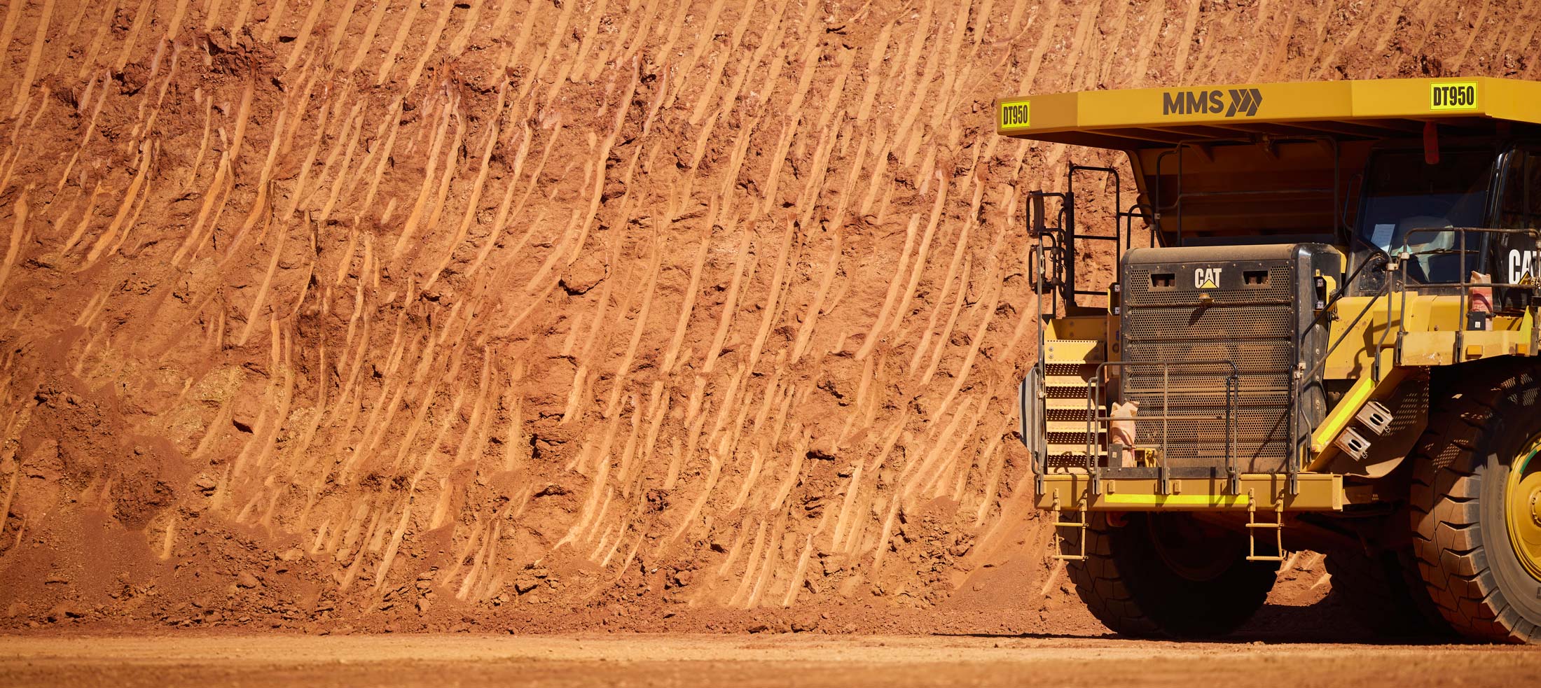 CAT-Dump-Truck-with-MMS-company-logo